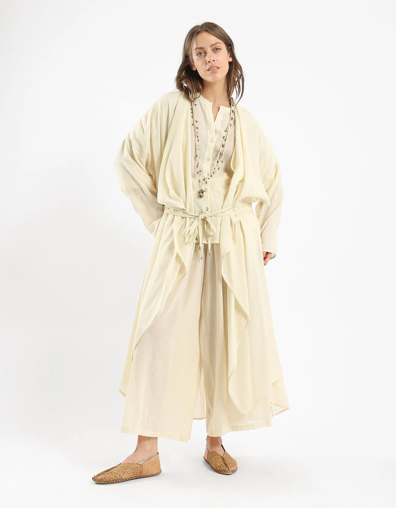 Long draped coat with decorative stitching details on the belt