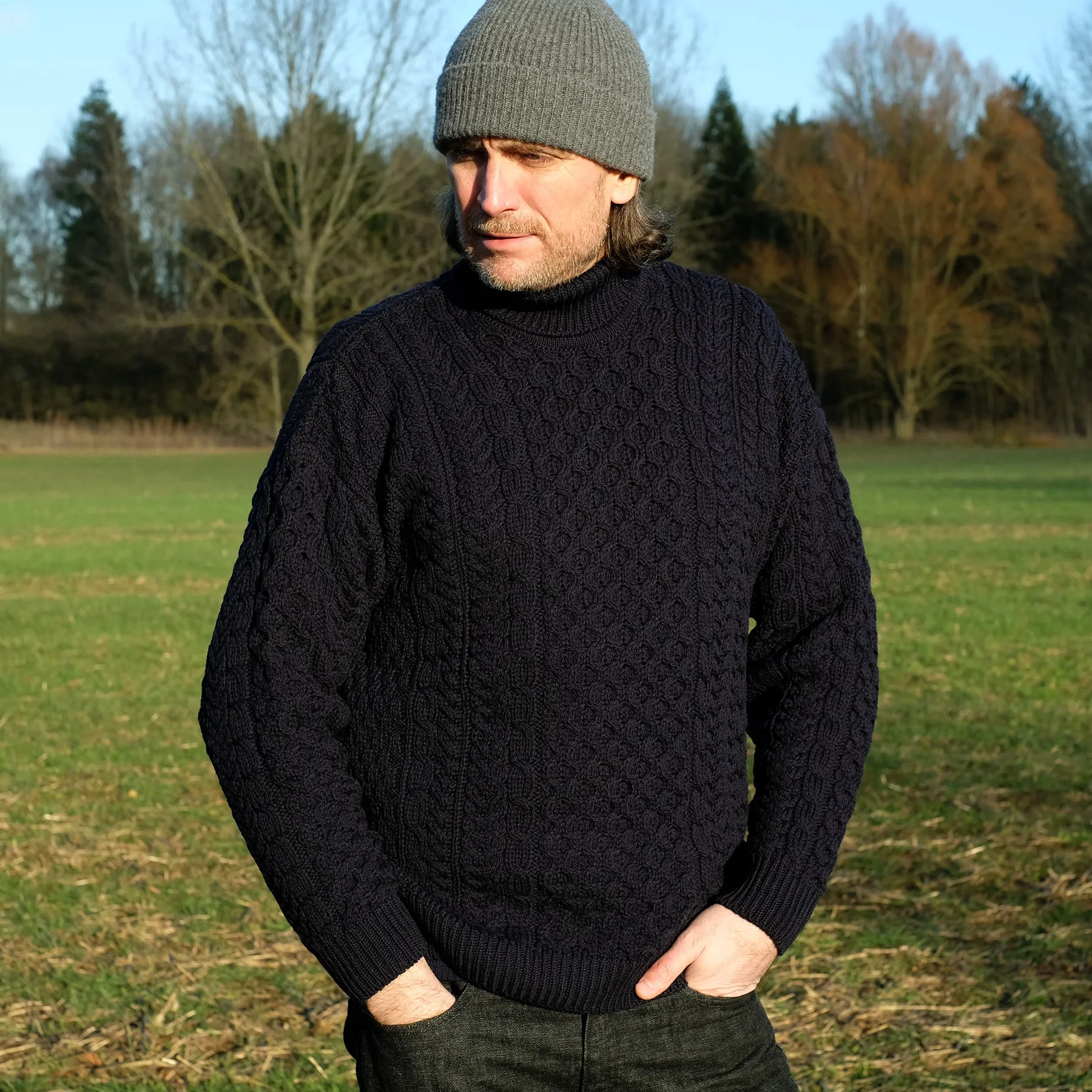 Traditional Aran polo neck sweater in Navy